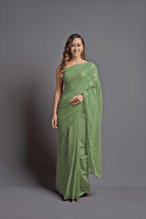 Looking This Designer Fancy Saree Paired With Blouse.This Saree Are Georgette And Blouse Are Banglori Silk Based Fabric With Designer Sequance Embroidery Work. Buy This Pretty Saree Now.