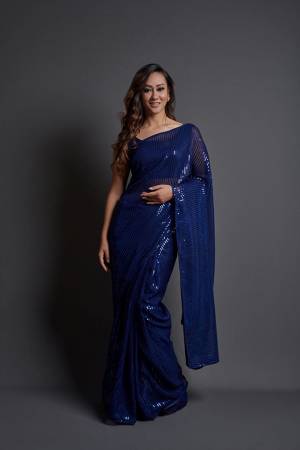 Attrective This Designer Partywear Saree Are Fine Dark Color Saree Paired With Blouse.This Saree Are Georgette And Blouse Are Banglori Silk Based Fabric With Heavy Designer Sequance Embroidery Work. Buy This Pretty Saree Now.