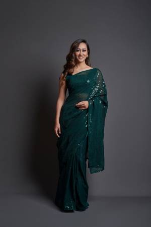 Attrective This Designer Partywear Saree Are Fine Dark Color Saree Paired With Blouse.This Saree Are Georgette And Blouse Are Banglori Silk Based Fabric With Heavy Designer Sequance Embroidery Work. Buy This Pretty Saree Now.