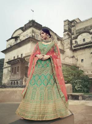 Look Attractive In This Designer Heavy Lehenga Choli In Ptrtty Color Paired?With Lovely Blouse And Dupatta. This Blouse And Lehenga Are Fabricated On Satin Paired With Soft Net Fabricated Dupatta. It Has Heavy Designer Glitter Dori,Jari With Thread Embroidery And Stone Work.Buy Now.