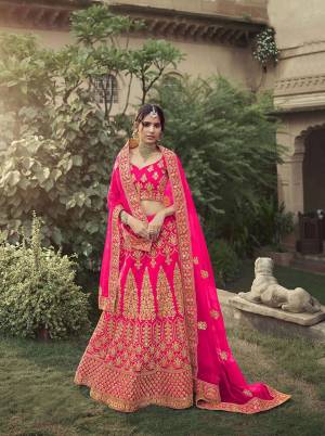 Look Attractive In This Designer Heavy Lehenga Choli In Ptrtty Color Paired?With Lovely Blouse And Dupatta. This Blouse And Lehenga Are Fabricated On Satin Paired With Soft Net Fabricated Dupatta. It Has Heavy Designer Glitter Dori,Jari With Thread Embroidery And Stone Work.Buy Now.