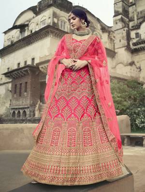 Look Attractive In This Designer Heavy Lehenga Choli In Ptrtty Color Paired?With Lovely Blouse And Dupatta. This Blouse And Lehenga Are Fabricated On Satin Paired With Soft Net Fabricated Dupatta. It Has Heavy Designer Glitter Dori,Jari With Thread Embroidery And Stone Work.Buy Now.