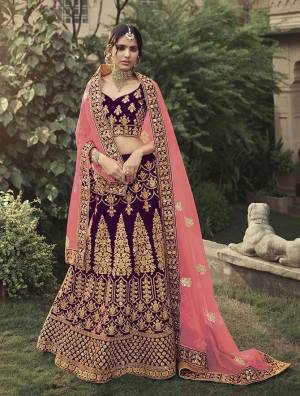 Look Attractive In This Designer Heavy Lehenga Choli In Ptrtty Color Paired?With Lovely Blouse And Dupatta. This Blouse And Lehenga Are Fabricated On Satin Paired With Soft Net Fabricated Dupatta. It Has Heavy Designer Glitter Dori,Jari With Thread Embroidery And Stone Work.Buy Now.