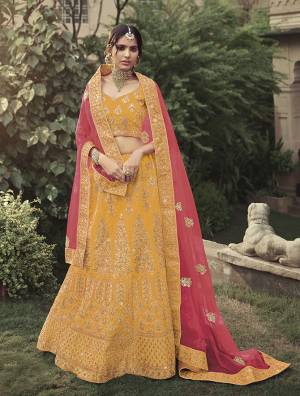 Look Attractive In This Designer Heavy Lehenga Choli In Ptrtty Color Paired?With Lovely Blouse And Dupatta. This Blouse And Lehenga Are Fabricated On Satin Paired With Soft Net Fabricated Dupatta. It Has Heavy Designer Glitter Dori,Jari With Thread Embroidery And Stone Work.Buy Now.