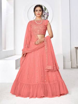 Look Attractive In This Designer Heavy Lehenga Choli In Pretty Color Paired With Lovely Blouse And Dupatta.Its Lehenga Is Net Based Fabric.Beautified With Heavy Thread,Sequance Embroidery Work.