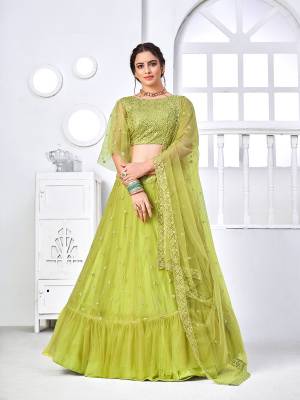 Look Attractive In This Designer Heavy Lehenga Choli In Pretty Color Paired With Lovely Blouse And Dupatta.Its Lehenga Is Net Based Fabric.Beautified With Heavy Thread,Sequance Embroidery Work.