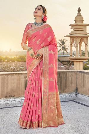 You Will Definitely Earn Lots Of Compliments Wearing This Pretty Elegant Looking Saree In Pretty Color Paired With Matching Colored Blouse.This Saree and Blouse Are Fabricated On Cotton. It Is Beautified With Printed Designer Weaving Work