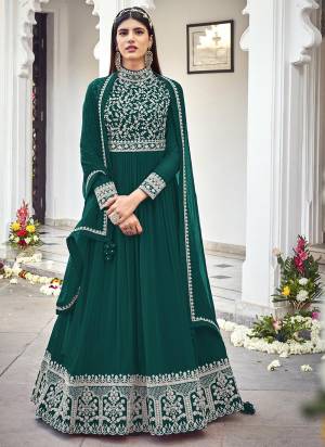 You Will Definitely Earn Lots Of Compliments In This Lovely Suit In Beautifull Colored Top Paired With Pretty Bottom And Dupatta. Its Top Is Fabricated On Faux Georgette Paired With Santoon Fabricated Bottom And Faux Georgette Dupatta Beautified With Heavy Designer Embroidery,Diamond Work.