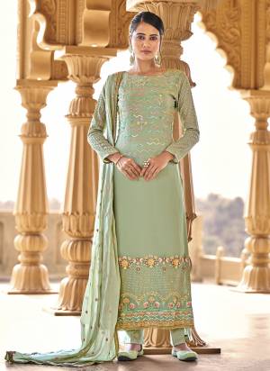 Bright And Visually Appealing Color Is Here With This Pretty Suit In Beautiful?Colored Pair Bottom And Dupatta. Its Top Is Fabricated On Viscose Bemberg Georgette Pair With Santoon Bottom And Chinon Chiffon Dupatta.Beautified With Designer Work