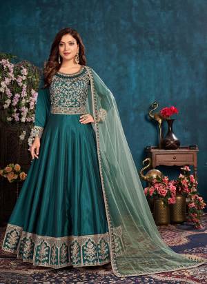 Simple And Elegant Looking Suit Is Here In Fine Colored.its Top is Fabricated On Art Silk Pair With Santoon Bottom And Net Dupatta.Beautified With Designer Heavy Embroidery Work