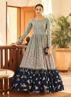 Celebrate This Festive Season With Beauty And Comfort With This Gown In Pretty Colored.This Gown Is Fabricated On Georgette Based With Metalic Foil Printed. It Will Definitely Earn You Lots Of Compliments From Onlookers