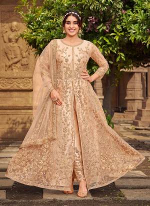 Grab These Designer Suit In Peach Color Top Pair With Matching Bottom And Dupatta.These Top is Fabricated On Butterfly Net Pair With Japan Satin Bottom And Net Dupatta.Its Beautified With Designer Work.