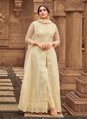 Grab These Designer Suit In Cream Color Top Pair With Matching Bottom And Dupatta.These Top is Fabricated On Butterfly Net Pair With Satin Banglori Bottom And Butterfly Net Dupatta.Its Beautified With Designer Work.