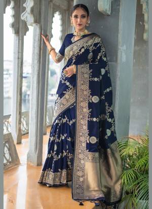 Enhance Your Beauty Wearing This Saree In Pretty Color Paired With Matching Colored Blouse. This Saree Is Fabricated On Banarasi Silk Paired With Banarasi Silk Fabricated Blouse. This Saree Is Beautified With Exclusive Wevon Designer. Buy This Saree Now