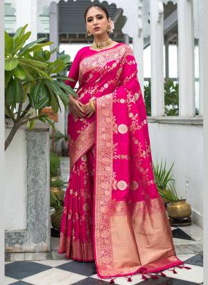 Enhance Your Beauty Wearing This Saree In Pretty Color Paired With Matching Colored Blouse. This Saree Is Fabricated On Banarasi Silk Paired With Banarasi Silk Fabricated Blouse. This Saree Is Beautified With Exclusive Wevon Designer. Buy This Saree Now