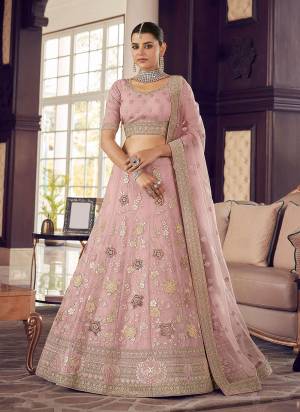 Look Pretty In This Lovely Shade With This Designer Heavy Lehenga Choli In?All Over Fine Colored.These Lehenga And Blouse Are Fabricated On Organza Based Pair With Soft Net Dupatta.Its Beautified With Heavy Designer Work.