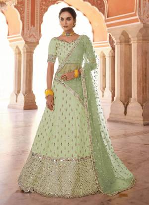 Flaunt Your Rich And Elegant Look Wearing This Designer?Lehenga Choli in All Over Beautiful Colored.These Lehenga And Blouse Are Fabricated On Art Silk Pair With Soft Net Blouse.Its Beautified With Heavy Designer Work.