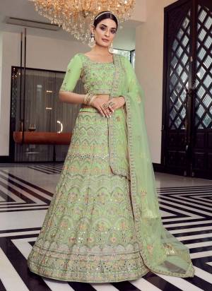 Enhance Your Personality Weaing This Beautiful Colored Lehenga.These Lehenga And Blouse Are Fbaricated On Organza Pair With Soft Net Blouse.Its Beautified With Heavy Designer Work.