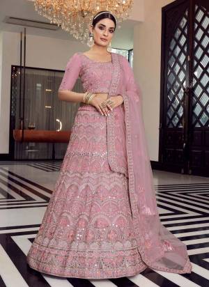 Enhance Your Personality Weaing This Beautiful Colored Lehenga.These Lehenga And Blouse Are Fbaricated On Organza Pair With Soft Net Blouse.Its Beautified With Heavy Designer Work.