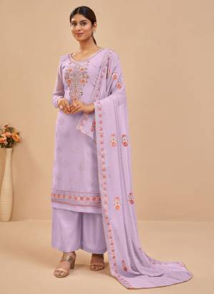 Look Pretty Wearing This Beatiful Colored Suit.These Suit And Dupatta Are Fabricated On Georgette Pair With Santoon Bottom.Its Beautified With Heavy Designer Work.