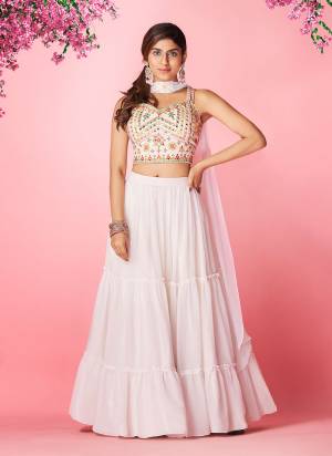 Grab These Lehenga Choli in All Over Beautiful Colored.These Lehenga And Dupatta Are Fabricated On Georgette Pair With Georgette Blouse.Its Beautified With Designer Thread Embroidery,Hand Work.