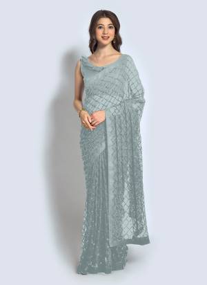 Grab These Saree in Fine Colored.These Saree is Fabricated On Georgette Pair With Banglori Silk Blouse.Its Beautified With Designer Sequance Embroidery Work.