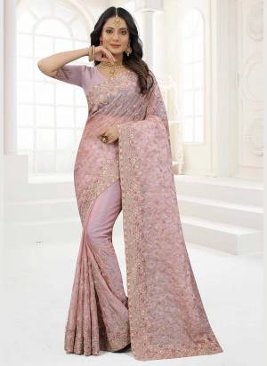 Grab These Saree in Fine Colored Pair With Matching Colored Blouse.These Saree And Blouse Are Fabricated On Organza.its Beautified With Designer Work.