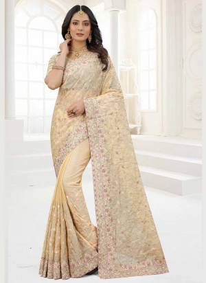 Grab These Saree in Fine Colored Pair With Matching Colored Blouse.These Saree And Blouse Are Fabricated On Organza.its Beautified With Designer Work.