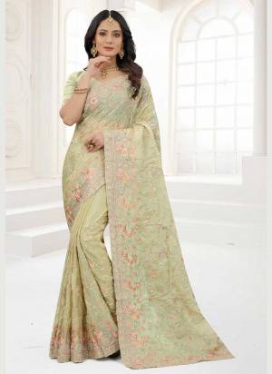 Grab These Saree in Fine Colored Pair With Matching Colored Blouse.These Saree And Blouse Are Fabricated On Organza.its Beautified With Designer Work.