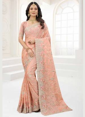 Grab These Saree in Fine Colored Pair With Matching Colored Blouse.These Saree And Blouse Are Fabricated On Organza.its Beautified With Designer Work.