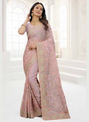 Grab These Saree in Fine Colored Pair With Matching Colored Blouse.These Saree And Blouse Are Fabricated On Organza.its Beautified With Designer Work.