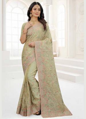 Grab These Saree in Fine Colored Pair With Matching Colored Blouse.These Saree And Blouse Are Fabricated On Organza.its Beautified With Designer Work.