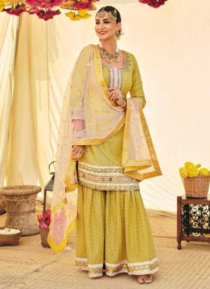 For A Designer Look,Grab These Sharara Suit in Fine Colored.These Top And Bottom Are Fabricated On Faux Georgette Pair With Soft Net Dupatta.Its Beautified With Heavy Designer Embroidery Work.