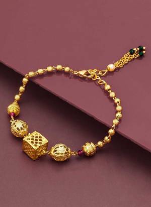  Looking Attrective To Your Personality By Pairing Up This Beautiful Brecelete With Your Ethnic Attire. This Pretty Gold Colored Brecelete Is  Beautified With Traditional Work. Buy Now.