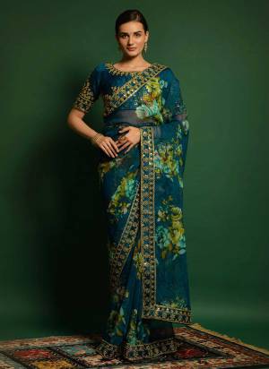 For A Casual Wear,Grab These Beautiful Colored Saree Pair With Blouse.These Saree is Fabricatd On Georgette Pair With Banglori Blouse.Its Beautified With Flower Printed,Codding And Sequance Embroidery Work.