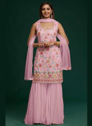 Grab These Sharara Suit in Fine Colored Pair With Bottom And Dupatta.These Top And Bottom Are Fabricated On Faux Georgette Pair With Net Dupatta.Its Beautified With Heavy Designer Embroidery Work.