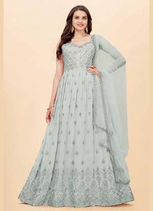 For A Designer Look,Grab These Suit in All Over Fine Colored Pair With Bottom And Dupatta.These Top Is Fabricated On Faux Georgette Pair With Santoon Bottom And Butterfly Net Dupatta.Its Beautified With Designer Sequance,Mirror Embroidery Work.