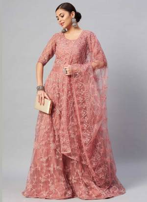 Grab These Gown in Fine Colored Pair With Dupatta.These Gown And Dupatta Are Fabricated On Net.Its Beautified With Thread Embroidery With Stone Work.