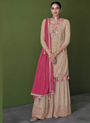 For A Designer Look,Grab These Sharara Suit in Fine Colored.These Top And Bottom Are Fabricated On Faux Georgette Pair With Faux Georgette Dupatta.Its Beautified With Heavy Thread,Mirror Embroidery Work.