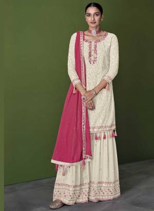 For A Designer Look,Grab These Sharara Suit in Fine Colored.These Top And Bottom Are Fabricated On Faux Georgette Pair With Faux Georgette Dupatta.Its Beautified With Heavy Thread,Mirror Embroidery Work.