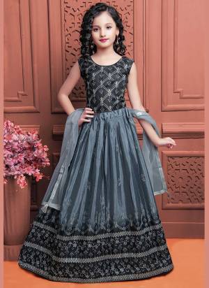 A Designer Look These Readymade Kidswear Lehenga Choli in Fine Colored.These Lehenga Are Chinon Silk And Blouse Are Fabricated On Banglori Silk Pair With Net Dupatta.Its Beautified With Sequance,Thread Embroidery Work.