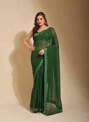 Grab These Saree in Fine Colored pair With Blouse.These Saree is Fabricated On Georgette Pair With  Satin Banglori Silk Blouse.Its Beautified With Chokdi Sequance Embroidery Work,Swarovski Border Work.