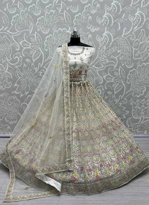 For A Designer Look,Grab These Lehenga Choli in Fine Colored.These Lehenga Choli Are Bridal Net And Dupatta Are Fabricated On Soft Net Pair.Its Beautified With Fancy Designer Multy Thread,Jari Embroidery,Diamond Work.