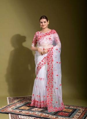 Grab These Saree in All Over Fine Colored Pair With Blouse.These Saree is Fabricated On Organza Pair With  Satin Organza Blouse.Its Beautified With Designer Red Thread Embroidery And Cut Work.