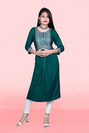 Attrective This Readymade Long Kurti In Fine Color Fabricated On Rayon Beautified With Designer Embroidery Work. It Is Light In Weight And Easy To Carry All Day Long. 