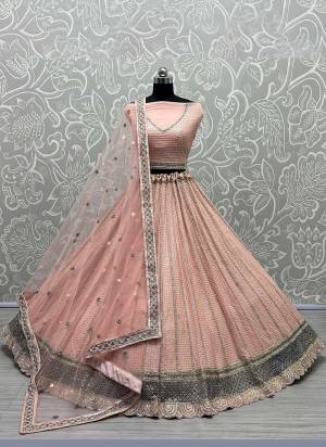 For A Designer Look,Grab These Lehenga Choli in Fine Colored.These Lehenga Choli Are Georgette And Dupatta Are Fabricated On Soft Net Pair.Its Beautified With Fancy Designer Multy Thread,Sequance,Dori Embroidery,Zarkan Work.