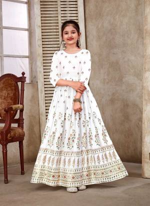 Stylist This Readymade Kids Long Gown In Fine Color Fabricated On Heavy Rayon Beautified With Designer Pigment Foil Printed. It Is Light In Weight And Easy To Carry All Day Long. 