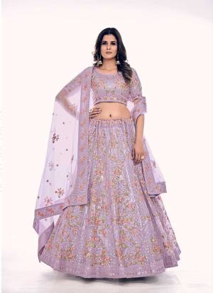 For A Designer Look,Grab These Lehenga Choli in Fine Colored.These Lehenga And Blouse Are Fabricated On Soft Net Pair With Soft Net Dupatta.Its Beautified With Designer Dori,Thread,Sequance Embroidery,Zarkan Work.