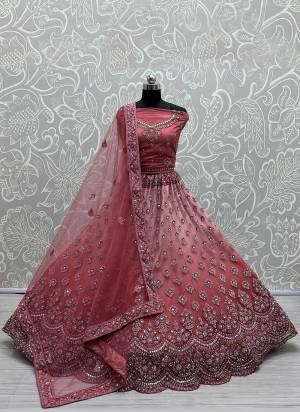 For A Designer Look,Grab These Lehenga Choli in Fine Colored.These Lehenga Are Silk Choli Are Silk And Dupatta Are Fabricated On Soft Net Pair.Its Beautified With Fancy Designer Thread,Jari Embroidery,Zarkan Diamond Work.