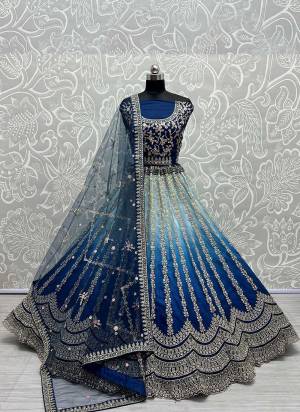 For A Designer Look,Grab These Lehenga Choli in Fine Colored.These Lehenga Are Silk Choli Are Silk And Dupatta Are Fabricated On Soft Net Pair.Its Beautified With Fancy Designer Thread,Jari Embroidery,Zarkan Diamond Work.